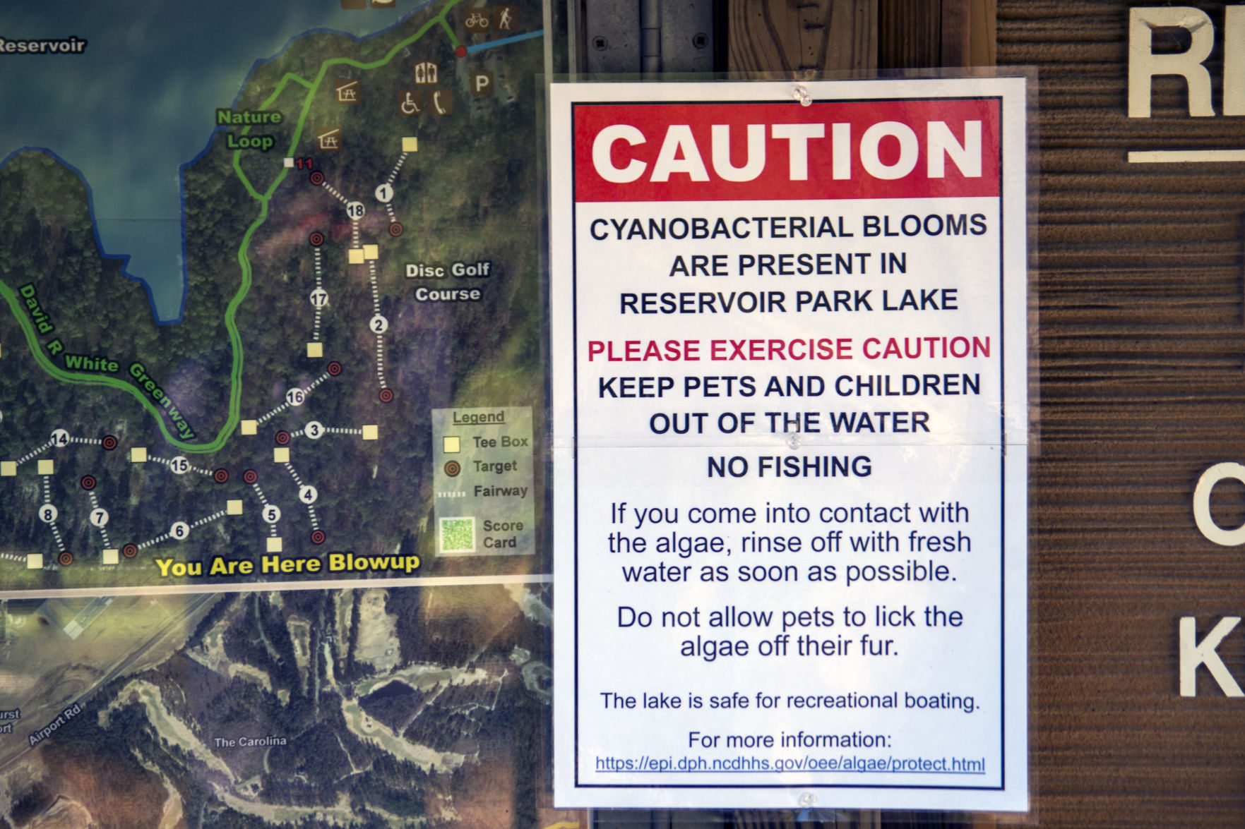 Sign posted at Reservoir Park following a recent algae bloom.